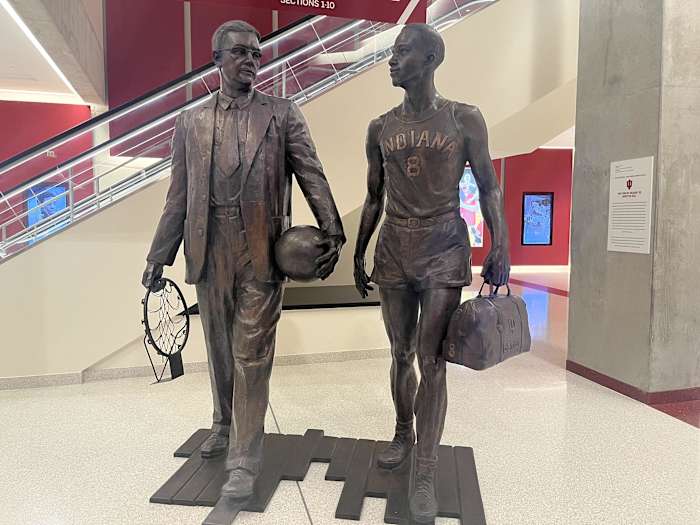 The statue of Bill Garrett (right) and coach Branch McCracken (left) stands in the south lobby of Simon Skjodt Assembly Hall in Bloomington, Ind.